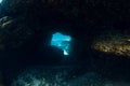 Underwater scene with tunnel cave in blue ocean Royalty Free Stock Photo