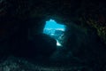 Underwater scene with tunnel cave in ocean Royalty Free Stock Photo