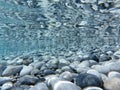 UNDERWATER sea level photo. Turquoise crystal clear water, pebbles of Agia Kyriaki beach in Kyparissi Laconia, Greece.
