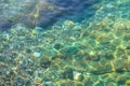 Underwater sea stones, surface with ripples and waves, beautiful pattern transparent clear water Royalty Free Stock Photo
