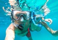 Underwater view of snorkeling couple in the sea Royalty Free Stock Photo