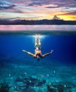 Underwater shoot of a young man snorkeling in a tropical sea and Royalty Free Stock Photo