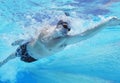 Underwater shot of professional male athlete swimming in pool Royalty Free Stock Photo