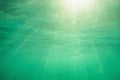 Underwater shot with sunrays and bubbles in deep tropical sea Royalty Free Stock Photo