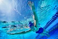 Underwater shot of woman swimming in pool