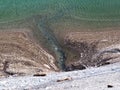 Underwater sources on the reservoir lake KlÃÂ¶ntalersee Kloentalersee or Klontaler lake and in the KlÃÂ¶ntal alpine valley Royalty Free Stock Photo