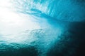 Underwater wave in tropical sea and sun rays. Water texture in sea