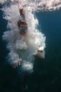 Underwater swimmer surrounded by bubbles Royalty Free Stock Photo