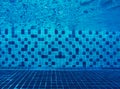 Underwater in the swimming pool and mosaic tiles blend ocean