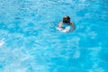 Underwater teen boy in the swimming pool with goggles in sunny day. Children Summer Fun. Kids water sport activity on Royalty Free Stock Photo