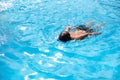 Underwater teen boy in the swimming pool with goggles in sunny day. Children Summer Fun. Kids water sport activity on Royalty Free Stock Photo