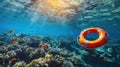 Underwater tranquility: A lifebuoy adrift in the crystal-clear embrace of a coral reef, where vibrant marine life paints a