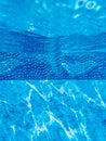 Underwater view of blue pool liner with swimming dolphin pattern