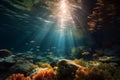Underwater view of a coral reef with fishes and sunbeams Royalty Free Stock Photo