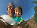 Underwater view of a father and her daughter with distorted face Royalty Free Stock Photo