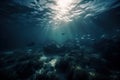 an underwater view of a large group of fish swimming in the ocean with sunlight coming through the w Royalty Free Stock Photo