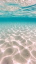 Underwater view of the ocean floor with sunlight filtering through the water.