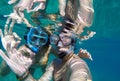 Underwater view of a snorkeling couple