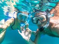 Underwater view of snorkeling couple in the sea Royalty Free Stock Photo