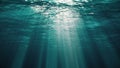 Underwater view with sunbeams shining and creating god rays in the deep sea