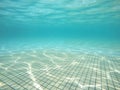 Underwater view of swimming pool floor with sunlight reflections Royalty Free Stock Photo
