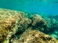 Underwater view of turquoise water and rocks in Sardinia Royalty Free Stock Photo