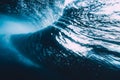 Underwater wave with sun light. Barrel wave crashing in ocean