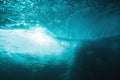 Underwater wave in tropical ocean and sun rays. Water texture in ocean