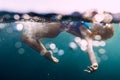 Underwater woman with bubbles in ocean Royalty Free Stock Photo