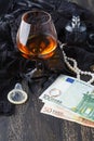 Underwear, cognac and money to symbolize the cost of sex