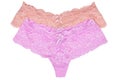 Underwear woman isolated. Close-up of two luxurious elegant pink and violet lacy thongs panties isolated on a white background. Royalty Free Stock Photo