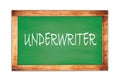 UNDERWRITER text written on green school board