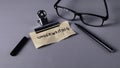 Underwriting Concept Note with Glasses, Pen, and Clip: Risk Assessment and Financial Approval Royalty Free Stock Photo