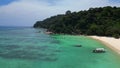 Undiscovered beach palm trees smooth rocks. Magic aerial top view flight drone