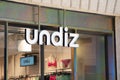 undiz logo brand and text sign on wall facade storefront fashion business