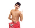 Undressed young man holding present Royalty Free Stock Photo