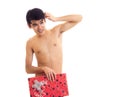 Undressed young man holding present Royalty Free Stock Photo