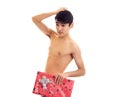 Undressed young man holding present Royalty Free Stock Photo
