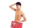 Undressed young man holding present Royalty Free Stock Photo