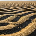 Undulating patterns of sand create a mesmerizing landscape with alternating light and shadow. The Royalty Free Stock Photo