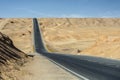 Undulating road in desert wilderness