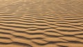 Undulating sand dunes exhibit symmetrical wavy patterns created by wind Royalty Free Stock Photo