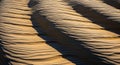 Undulating sand dunes form a repetitive pattern, showcasing ripples created by wind erosion. The Royalty Free Stock Photo
