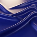 Undulating waves of glossy blue fabric create a smooth, flowing pattern. The material Royalty Free Stock Photo