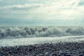 An uneasy black sea with waves and foam. View from the shore, tinting Royalty Free Stock Photo