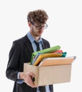 Unemployed Business man worker carrying packed box with upset expression for unemployment concept isolated on white Royalty Free Stock Photo