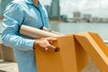 Unemployed businessman is carrying a brown cardboard box. Unemployed and economy concept Royalty Free Stock Photo