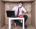 Unemployed businessman conducts a job interview on the phone, looks for a job, holds placards in his hands with the word WORK