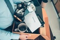 Unemployed hold cardboard box and resignation letter, dossier, alam clock, coffee cup, calculator and drawing tube in box. Quiting Royalty Free Stock Photo