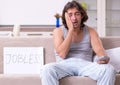 Unemployed man desperate at home Royalty Free Stock Photo